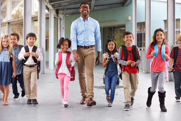 Teacher walking with students